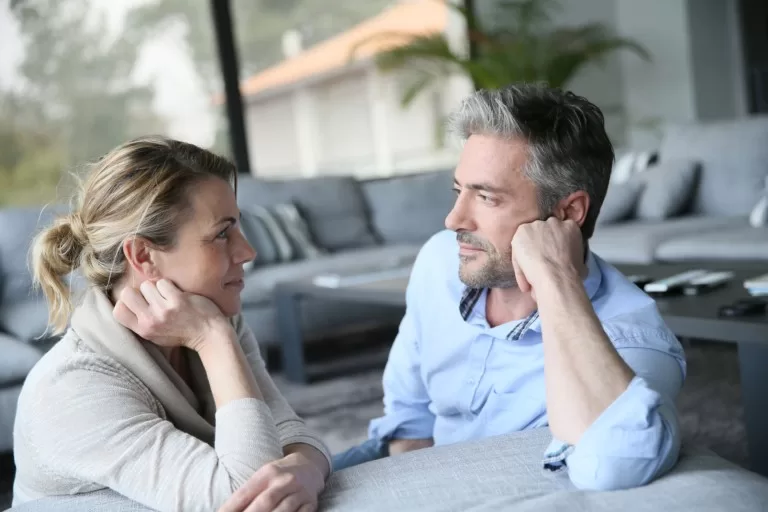 Mirroring or mimicry example - man and women facing each other, both resting their head on their arm.